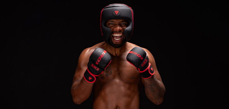 mma gloves on a heavy bag