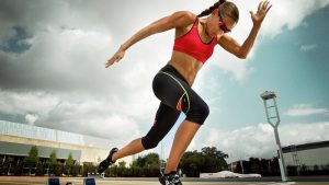 Athlete running outside black and red clothing