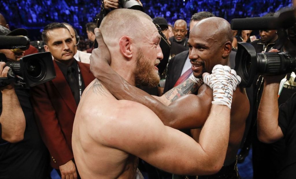 boxers standing inside ring Mayweather vs McGregor Aftermath
