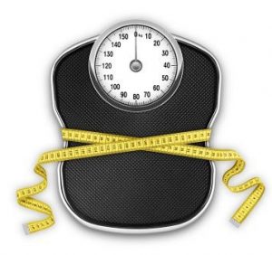 Measurement tape around scale Diet vs. exercise