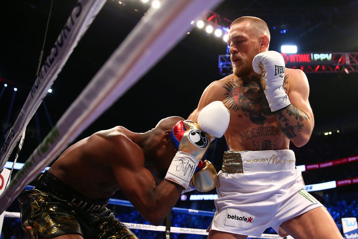 boxers fighting inside the ring Mayweather vs McGregor aftermath