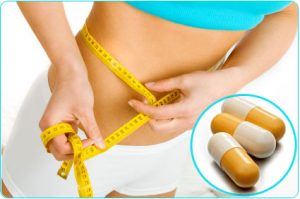 weight loss blue crop top shirt yellow measuring tape brown white capsules in blue circle white shorts