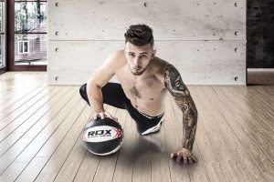 man holding RDX Medicine Ball