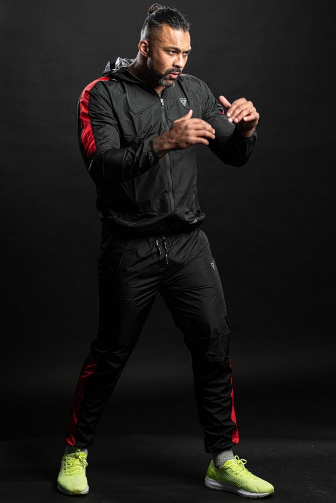 Chi Lewis wearing sauna suit and working out