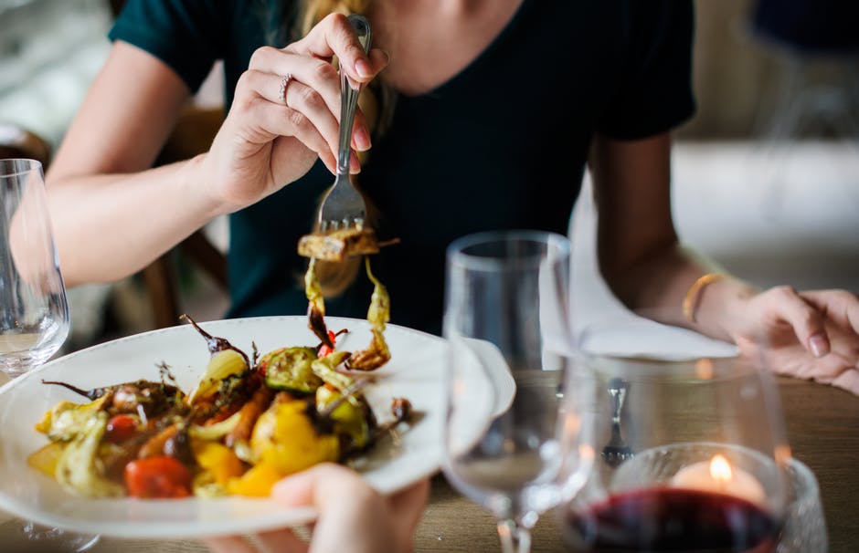 Woman eating food with a fork