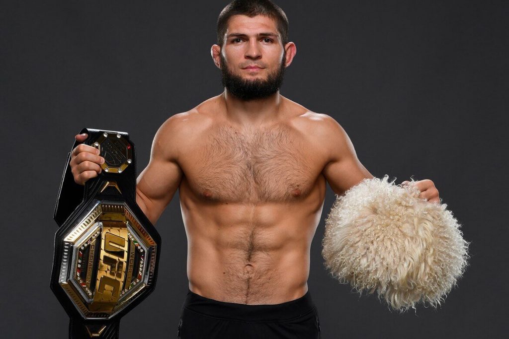 Khabib Nurmagomodev holding his belt