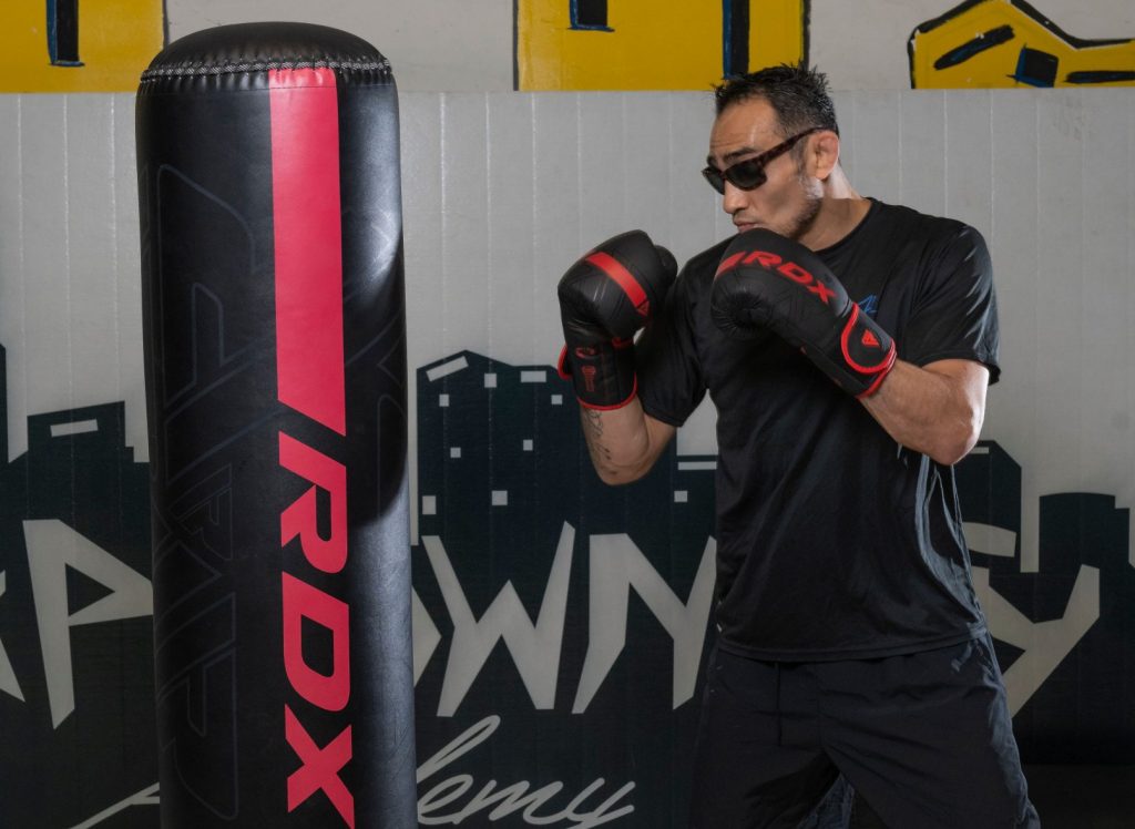 tony tightens his fists before throwing a Jab