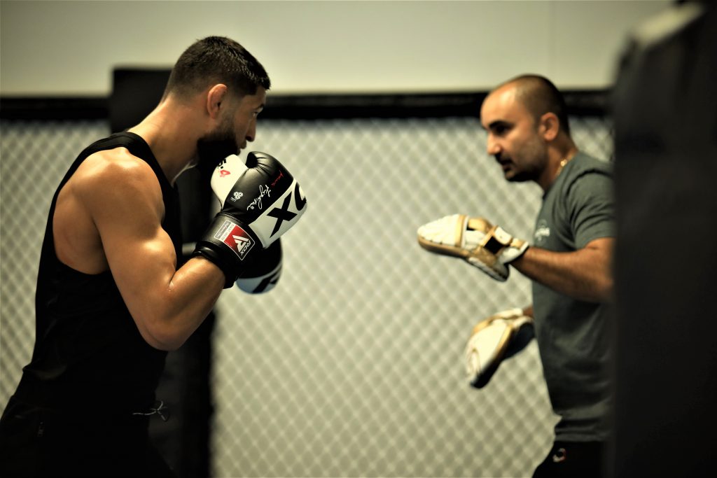 Why are Personal Trainers Important for Healthy Living? Celebrate the Mentors in Your Life! Khamzat Honing His Skills with His Trainer Andreas Michael