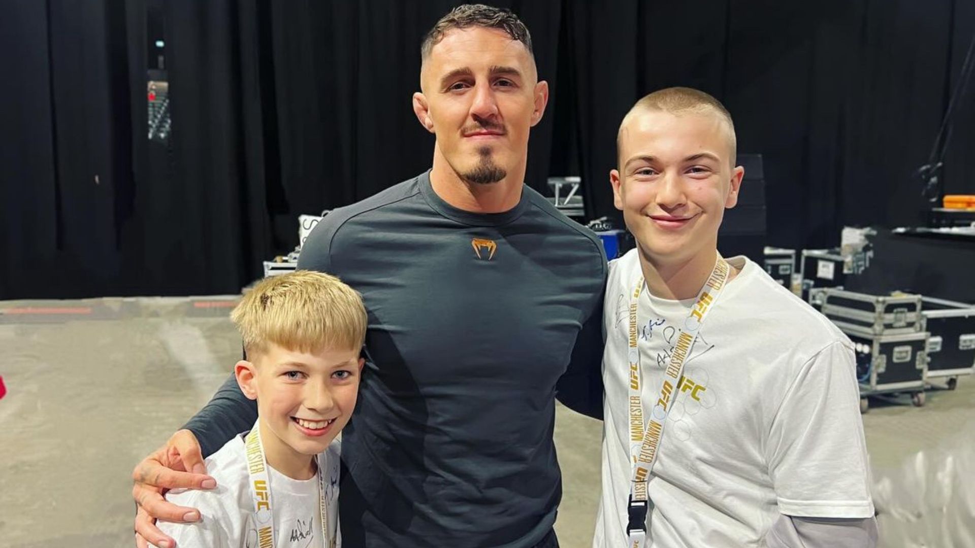 Tom Aspinall backstage at UFC 304 weigh-ins with kids from OnSide Youth Zone Wigan
