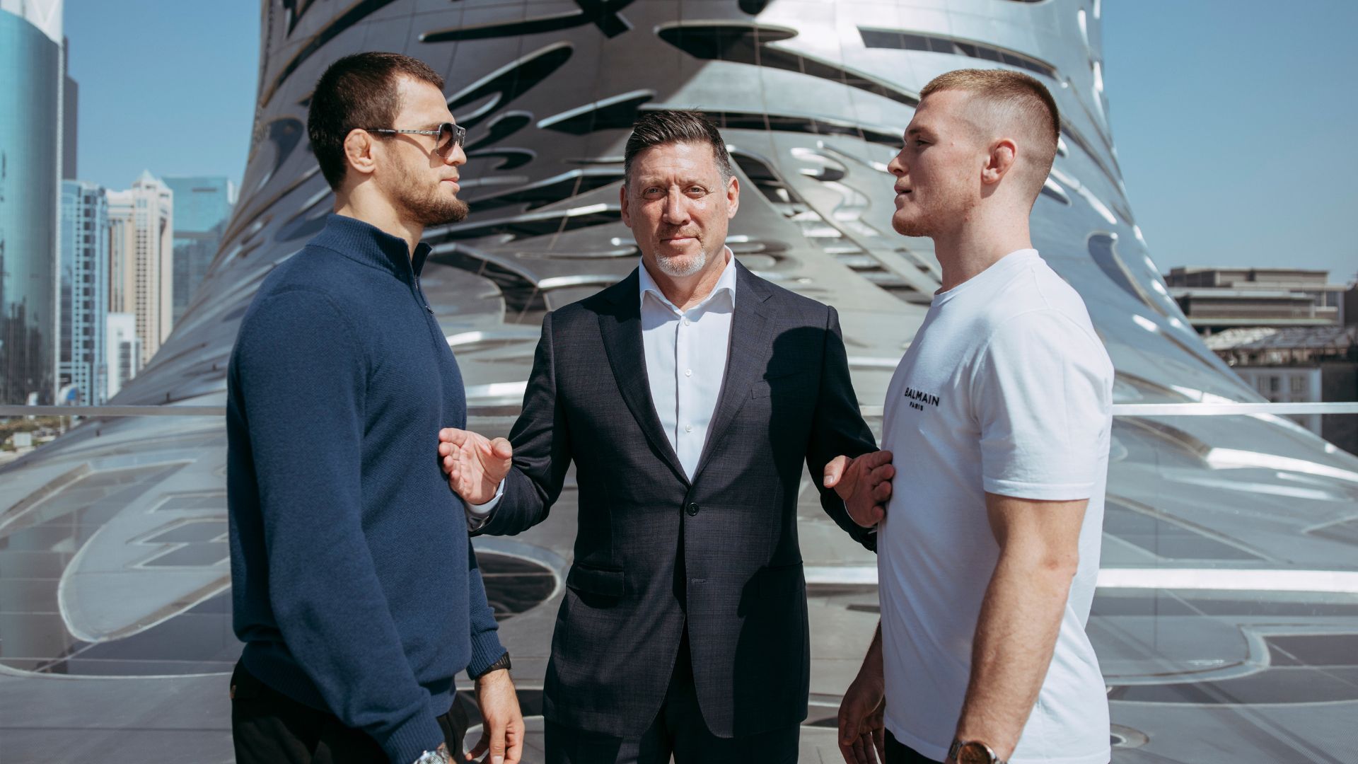 Usman Nurmagomedov and Paul Hughes, with Peter Murray